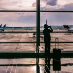 Airplane and traveler representing flight tracking for Puerto Vallarta airport transfer